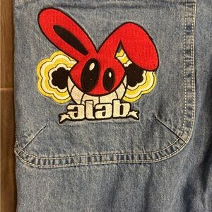 Men's Relaxed Fit Jeans with Red Graphic Patch